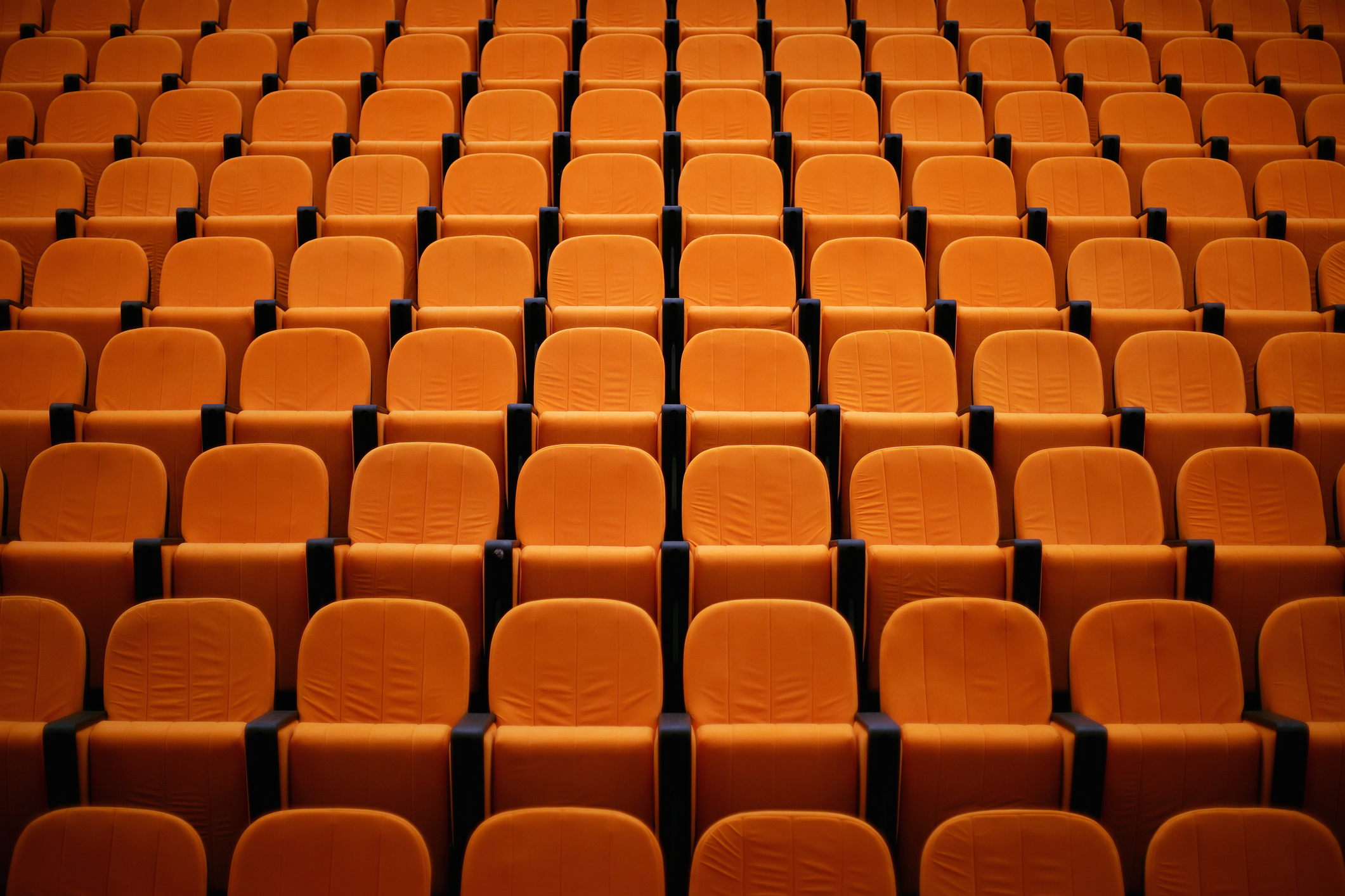 Empty seats in a college lecture hall.